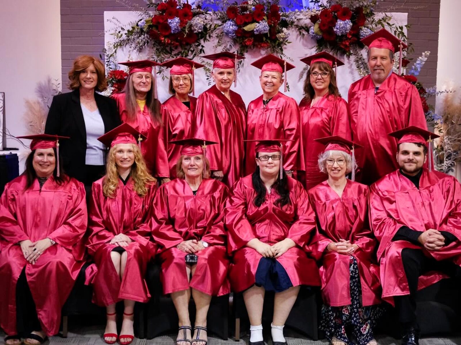 The Faith Outreach family gathered in caps and gowns to celebrate a graduation