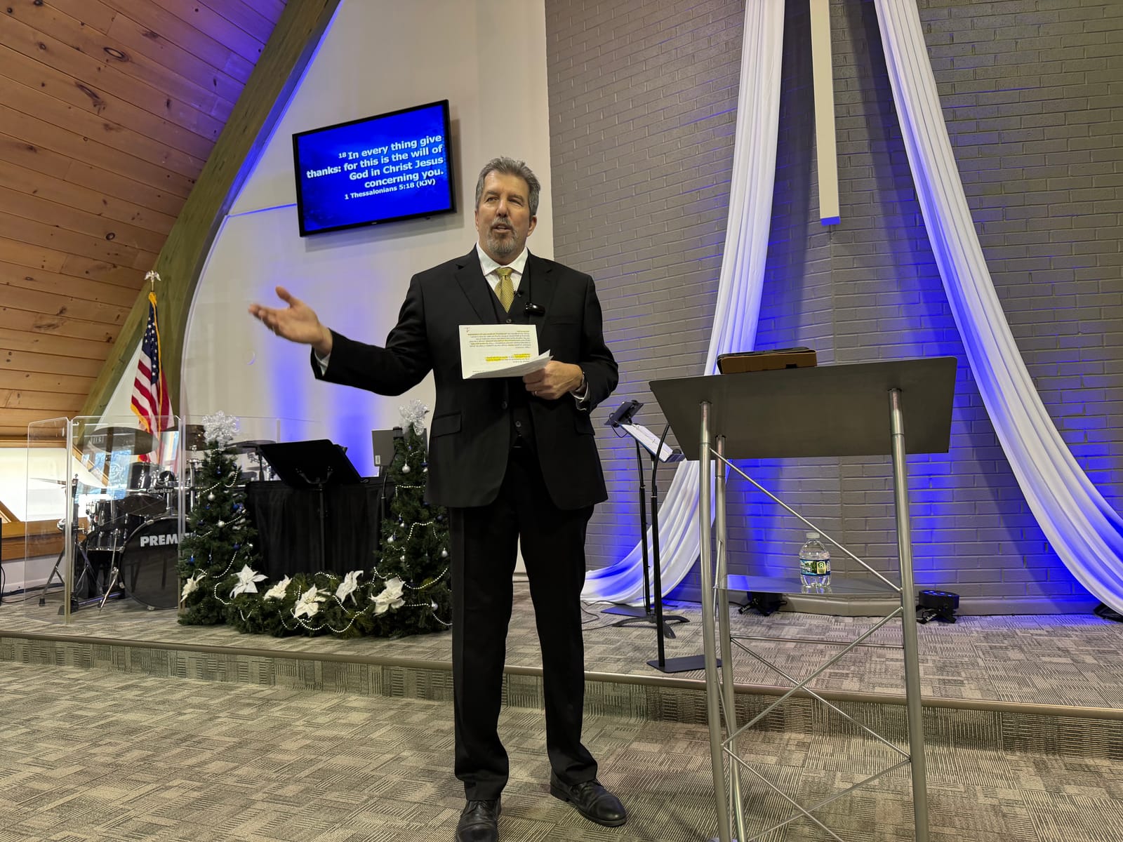 Pastor J.C. Neff preaching during a service at Faith Outreach Church