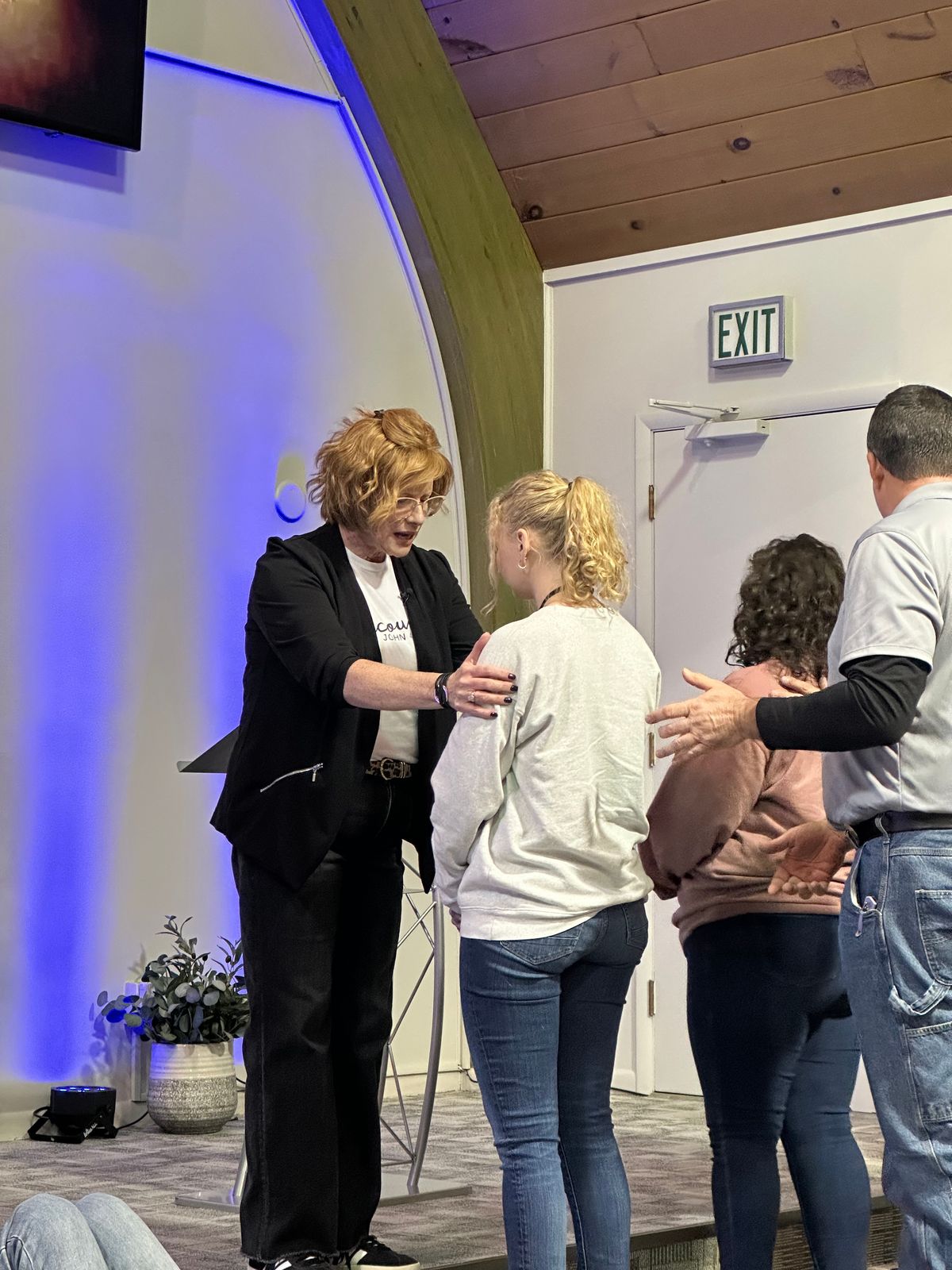 Praying over one another — the heart behind Faith Outreach's outreach