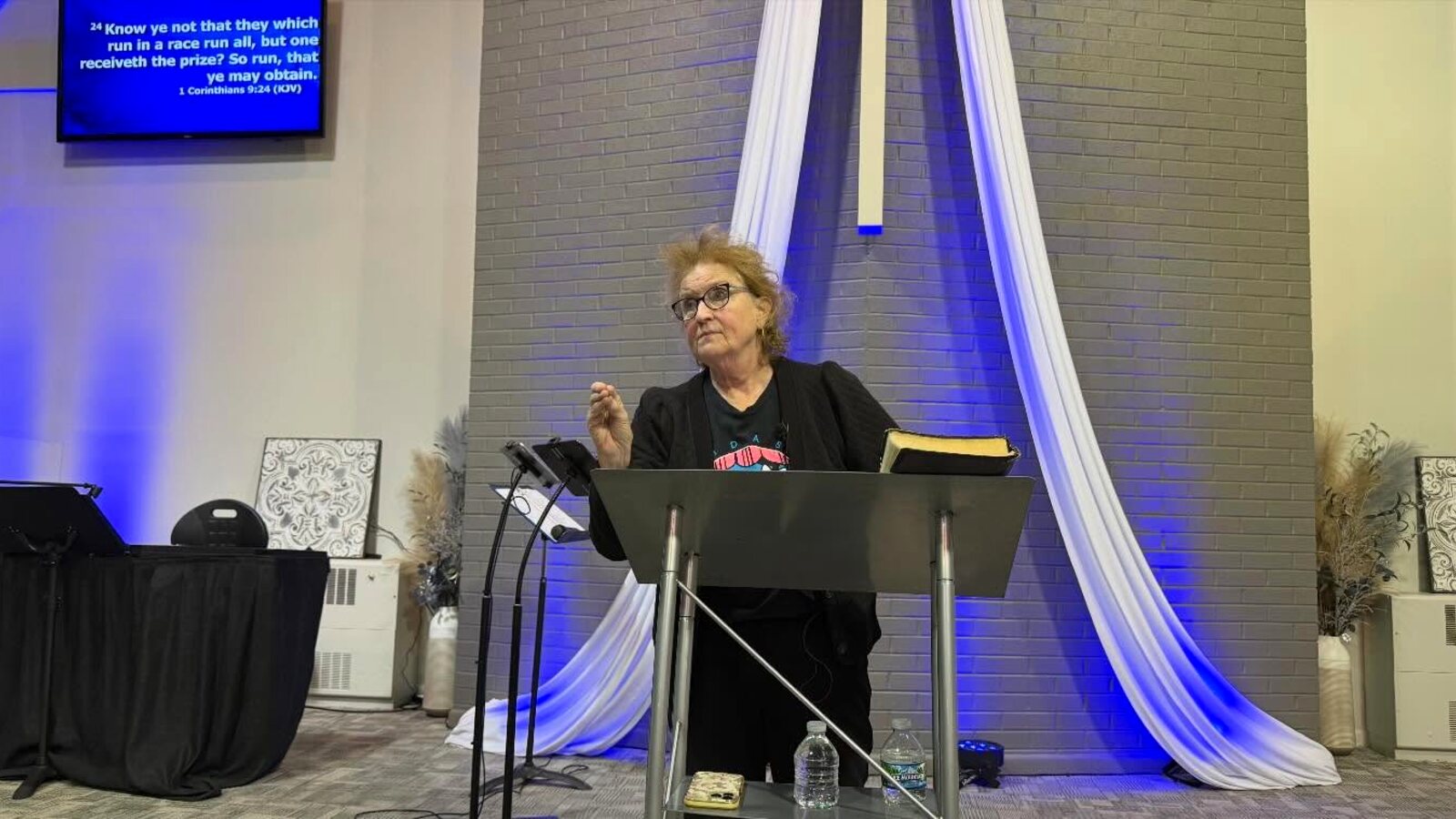 A message shared from the pulpit beneath the cross at Faith Outreach Church