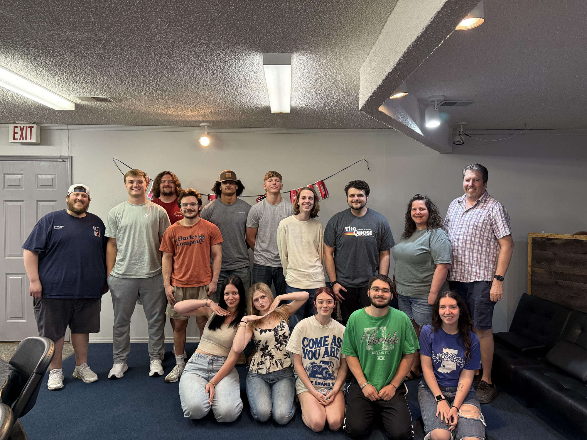 Students and leaders of the Faith Outreach youth ministry gathered in the youth room